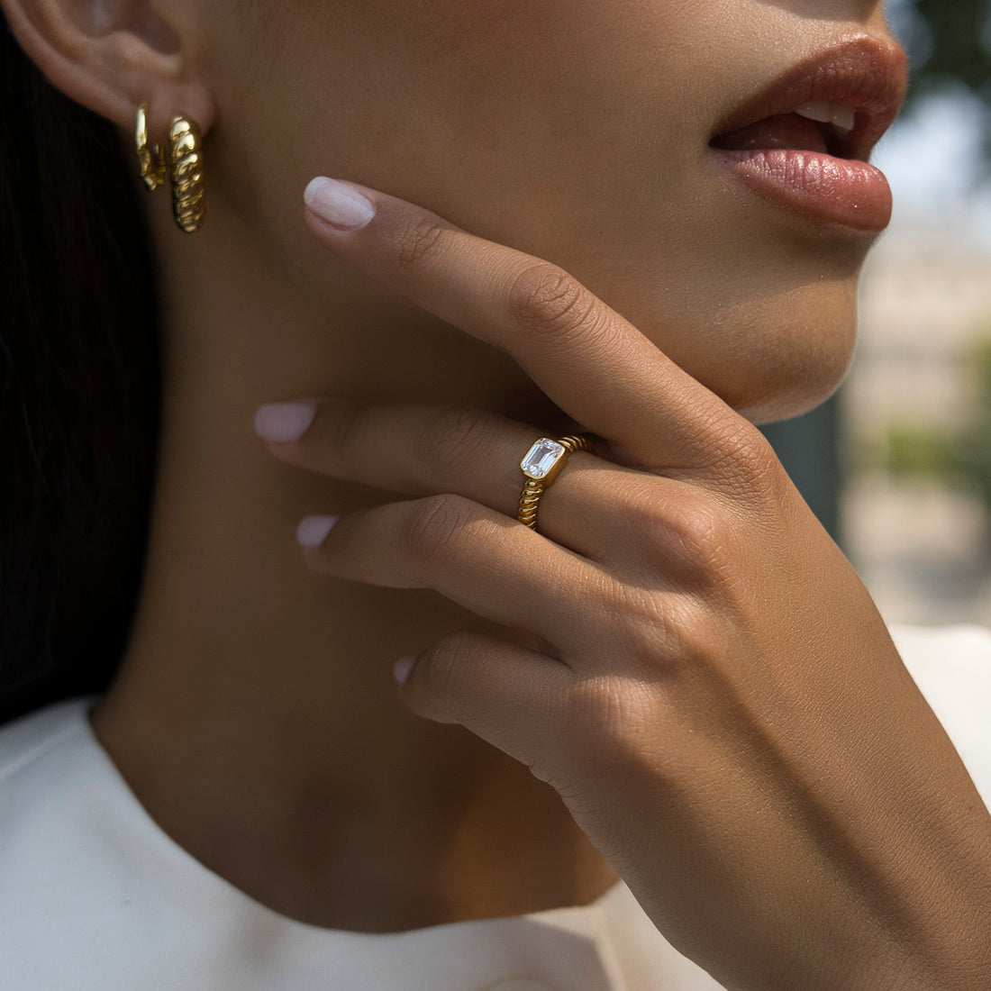 EMERALD CUT CROISSANT RING